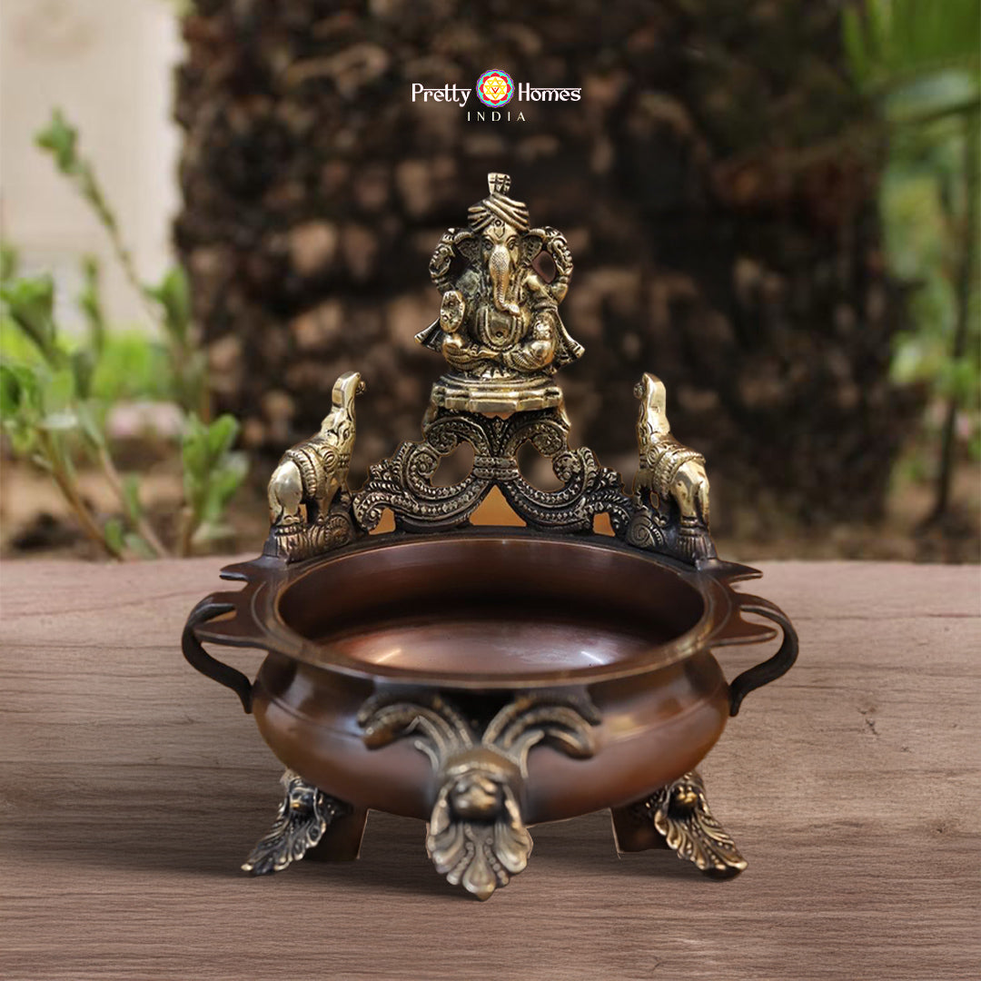 brass Ganesh urli with copper finish featuring intricate carved detailing