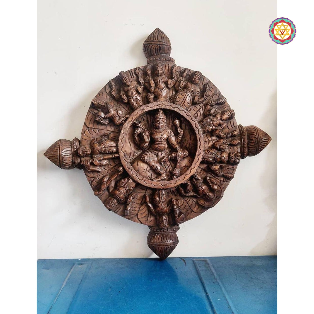 Multicolour round wood carving representing eight forms of Lakshmi