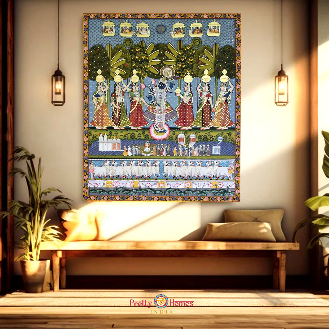 Hand-painted Pichwai panel showcasing lord Krishna’s childhood adventures in pastoral backdrop