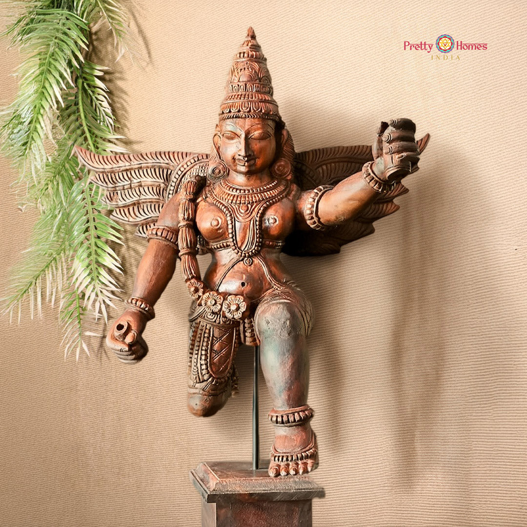 Handcarved Garuda sculpture mounted on a decorative stand