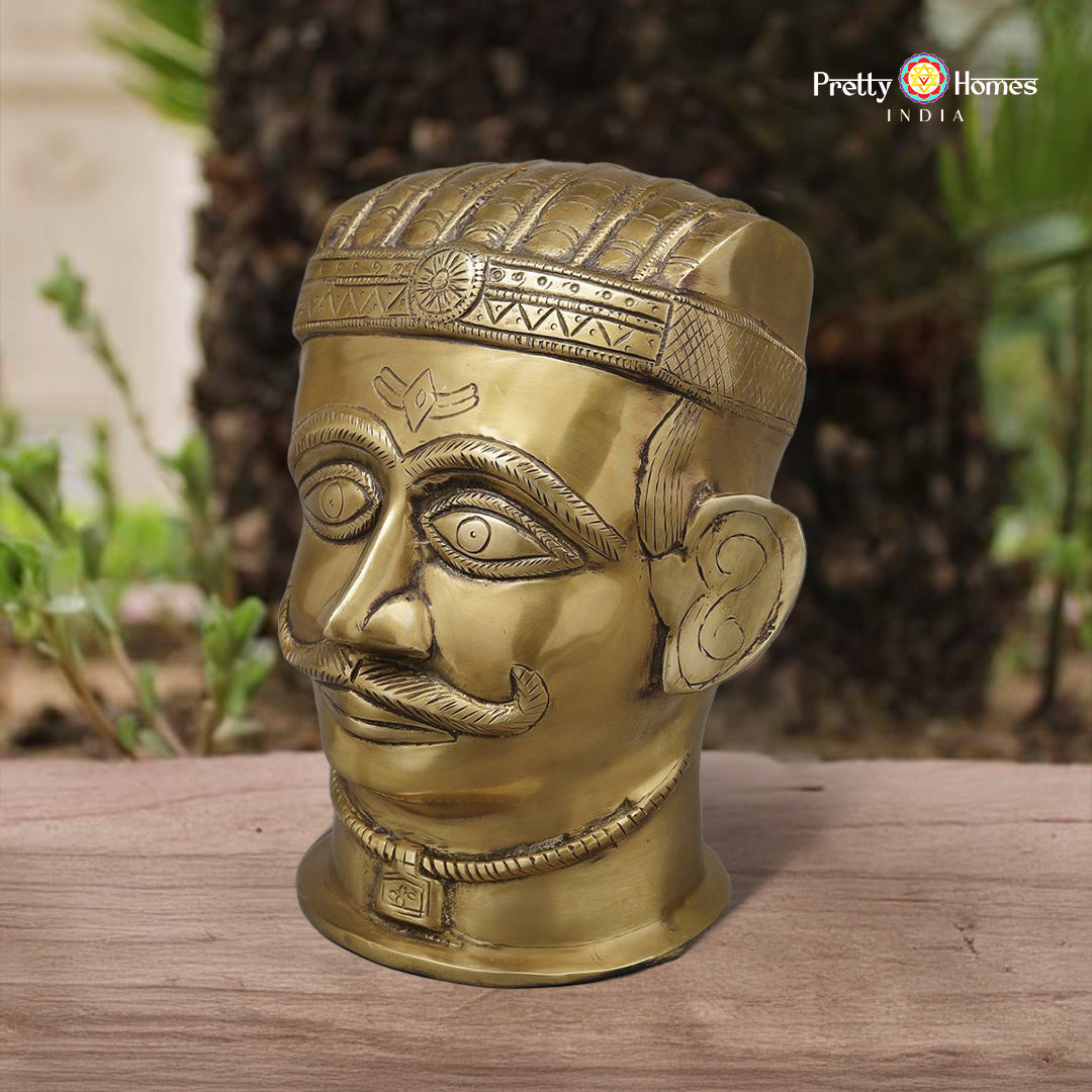 brass Shiva face idol with intricate handcrafted detailing in polished finish
