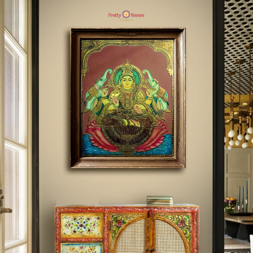 Framed Gajalaxmi Tanjore painting with intricate gold detailing