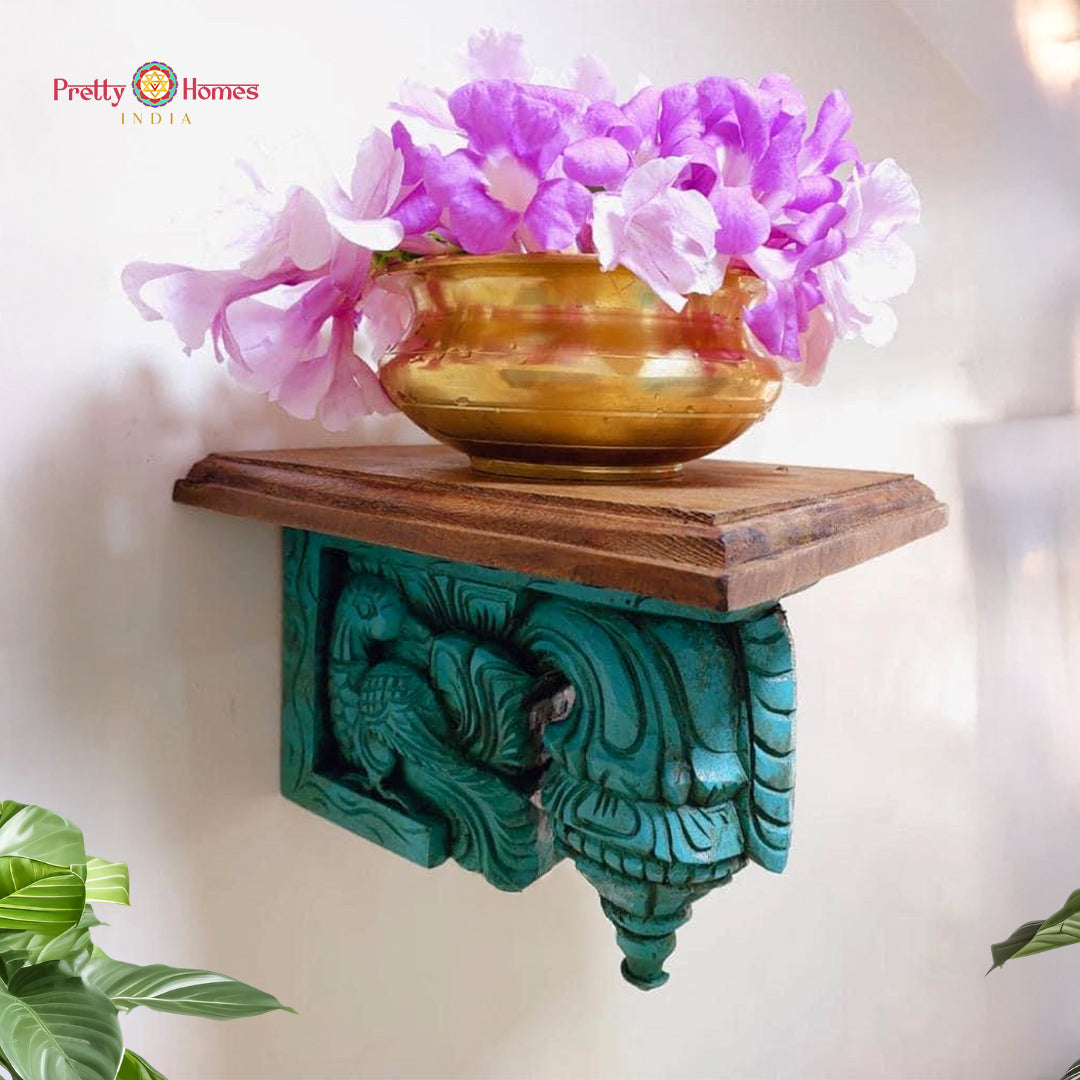 Full view of wooden bodhil bracket with peacock carving, showing intricate floral patterns and traditional craftsmanship