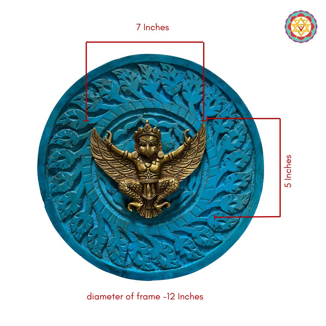 Brass Garuda wall décor displayed above an entrance console setup