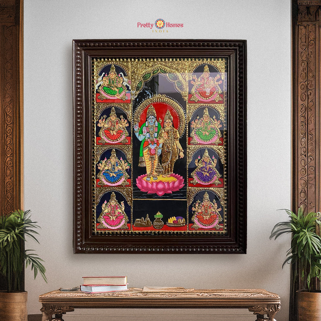 “Framed Ashtalakshmi with Lord Vishnu Tanjore painting in gold foil displayed on wall with traditional decor”