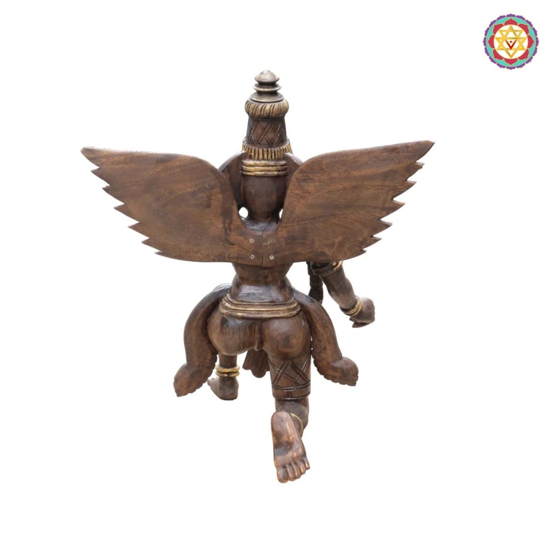 handcarved garuda statue close up showing detailed wings and textures
