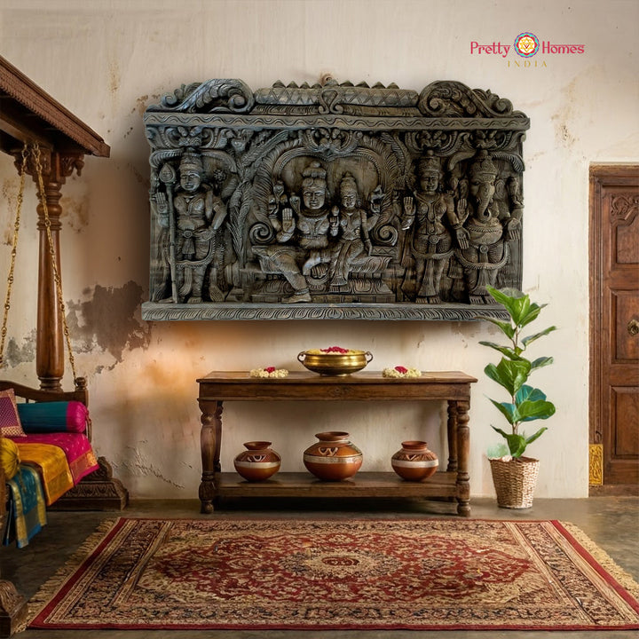 Horizontal Shiva family wood carved panel featuring Shiva Parvati Ganesha Murugan and Lakshmi temple wall decor