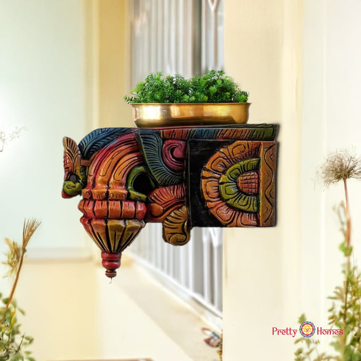 “Handcarved carved wooden wall bracket with Bodhi leaf and bird motif” 