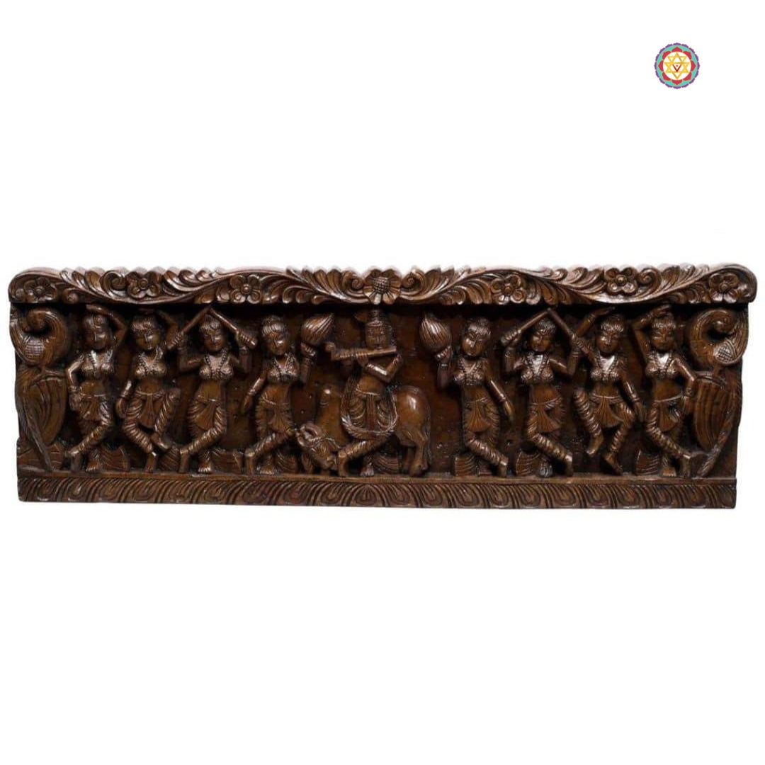 Krishna and gopikas carving — traditional wooden temple wall decor.
