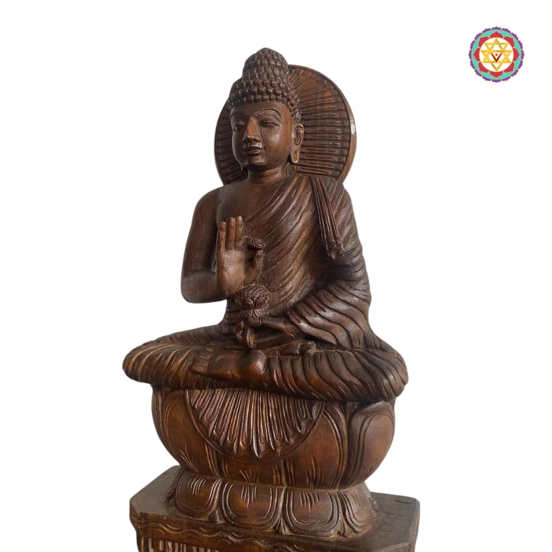 close-up of wooden buddha sculpture showing calm expression