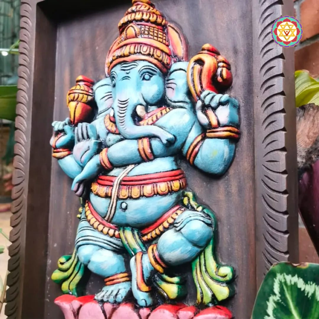 close-up of detailed carvings on dancing ganesha wood idol
