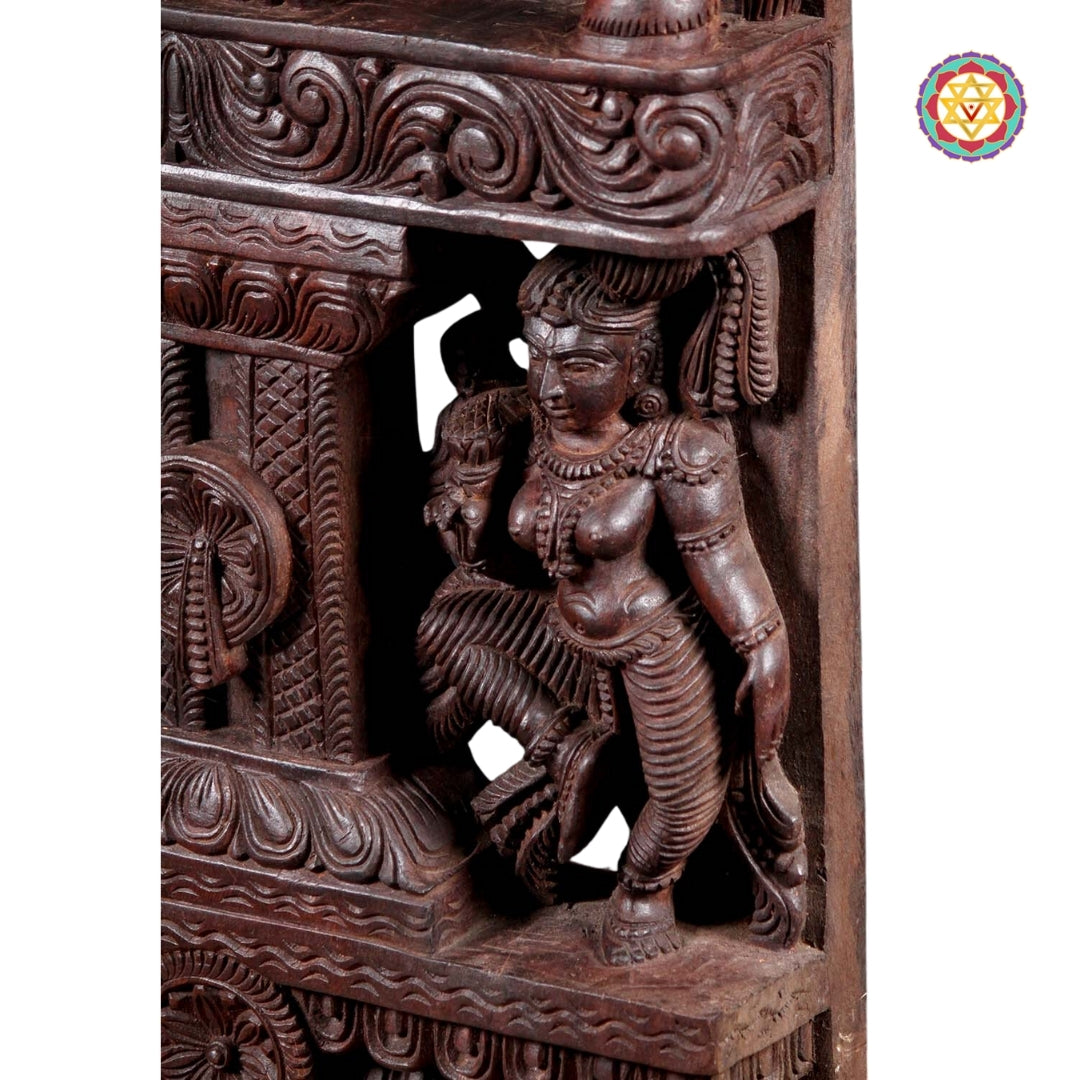 Detailed close-up of Krishna wood carving showing layered details and handpolished finish