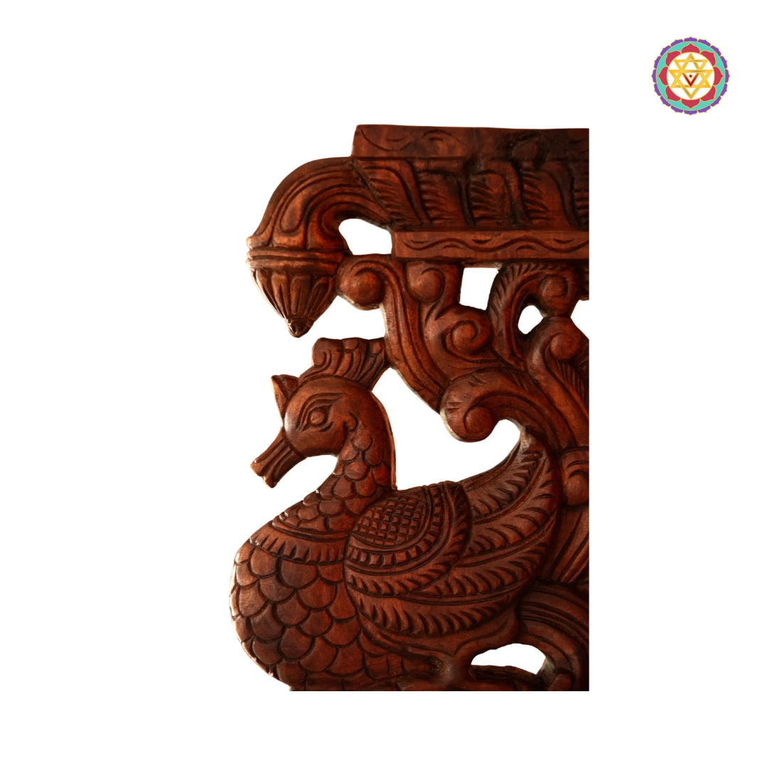 Side view of Annapakshi carving with floral elements