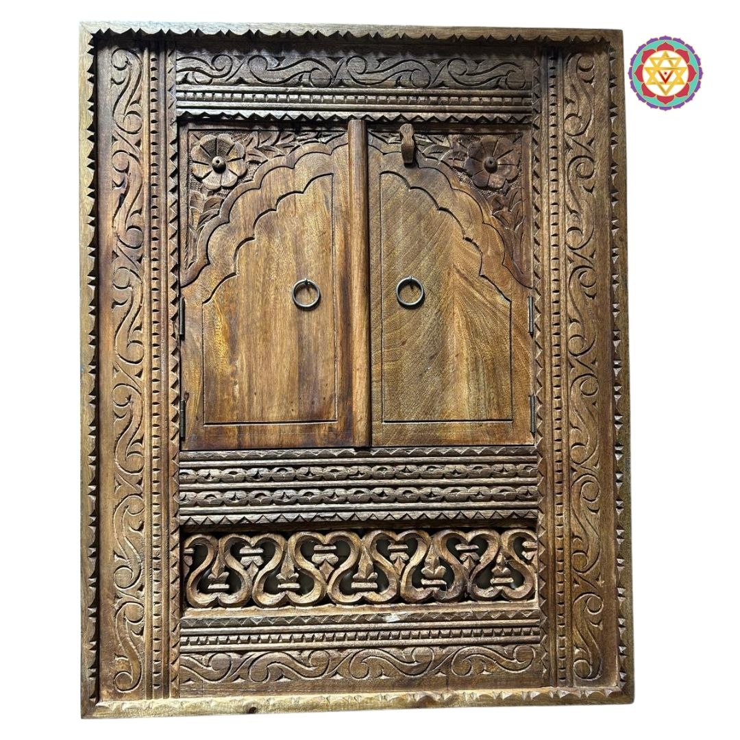 “Detailed view of hand-carved wooden jharokha window with floral and geometric patterns.”
