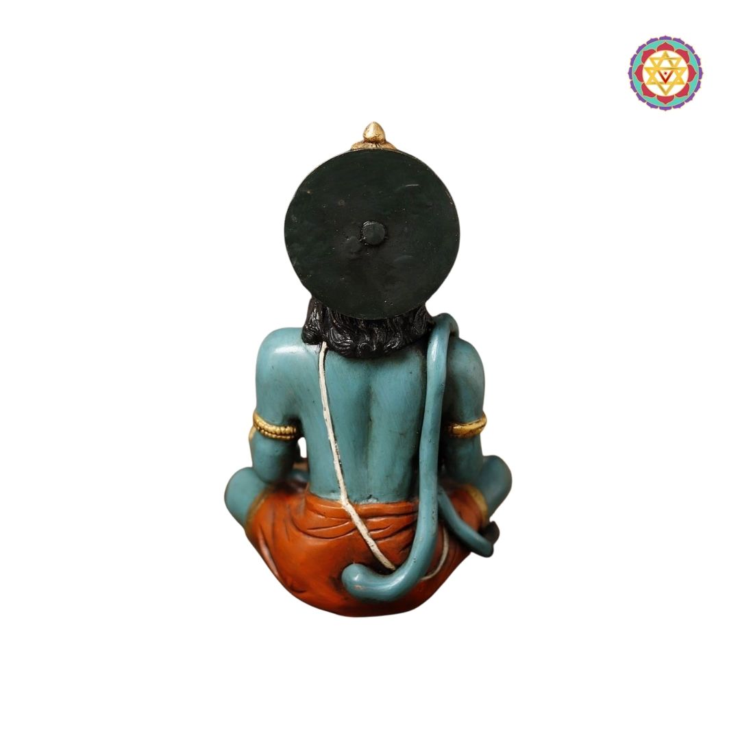 side view of Hanuman figure highlighting muscular form and ornamental adornments