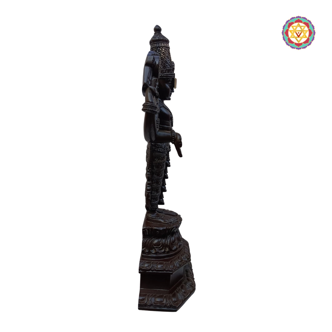 carved teak perumal statue showing hand finished details and craftsmanship