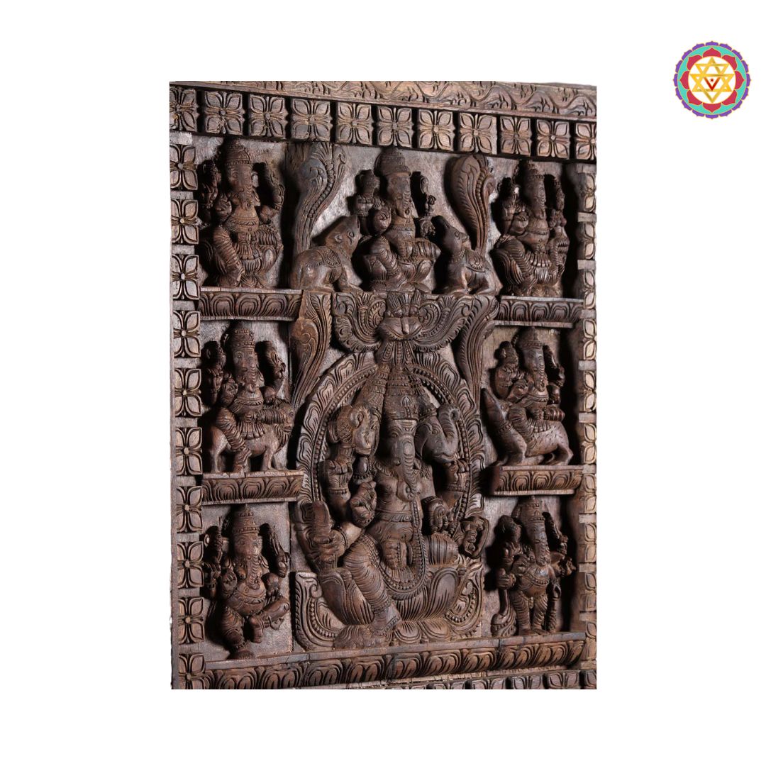 close-up of detailed astaganesh carving on wooden frame