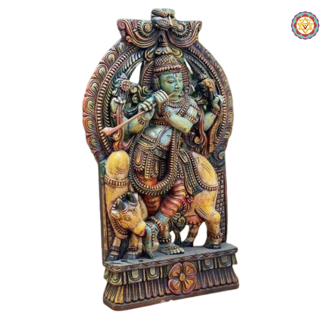 Side profile of wooden Lord Krishna sculpture, wooden hand carved lord krishna standing under cow statue stand alone decor piece