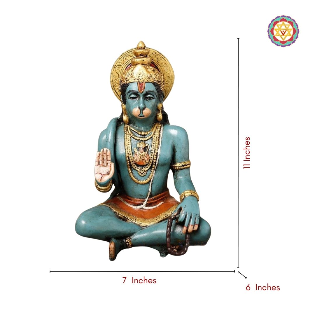 Hanuman statue displayed in a prayer setting with textured polishes