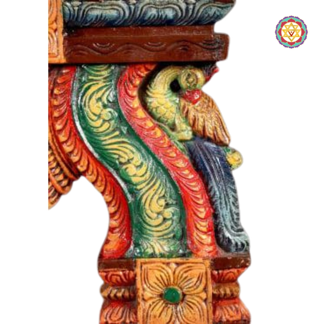 hand-carved wooden wall hanging of goddess lakshmi seated on lotus