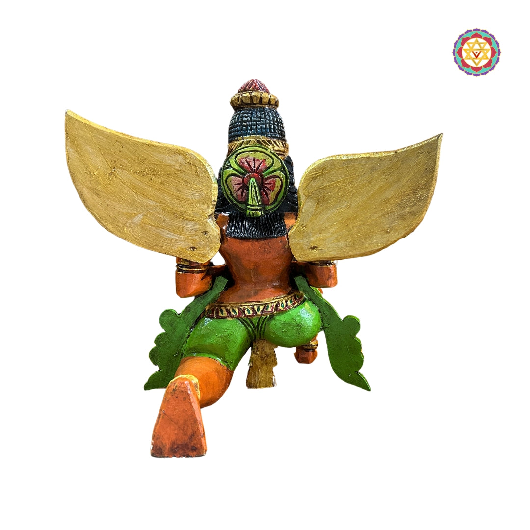 Rear view of Garuda sculpture showing wing and robe carving details — handcrafted wooden deity statue
