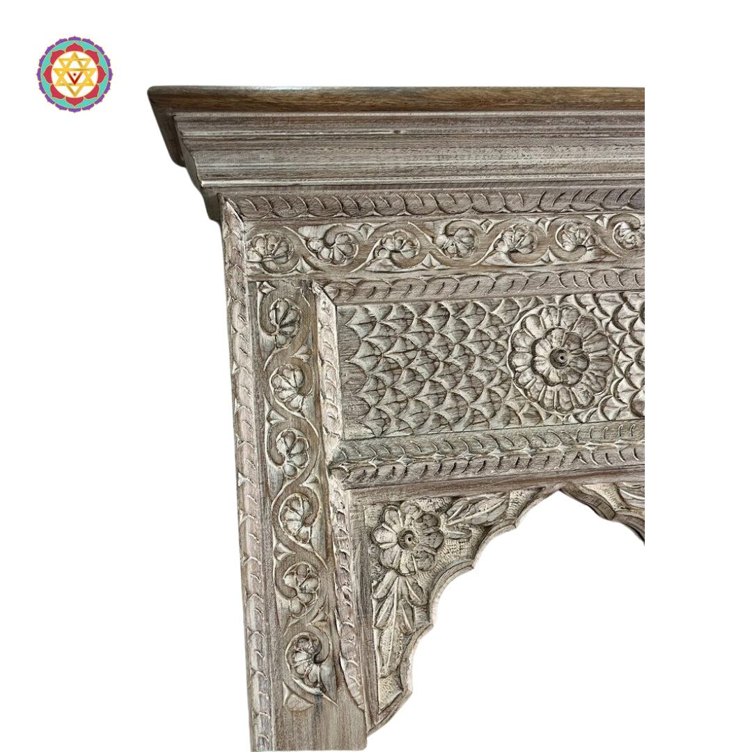 “Wooden Jharokha mirror frame with rich floral motifs and a charming antique look.”