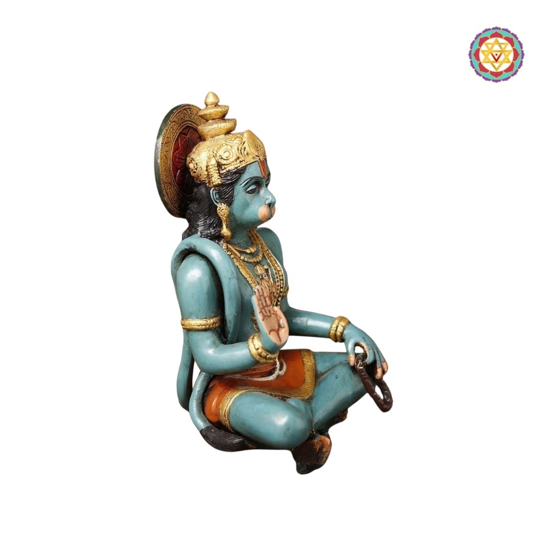 close-up of Hanuman idol showing expressive face and painted accents