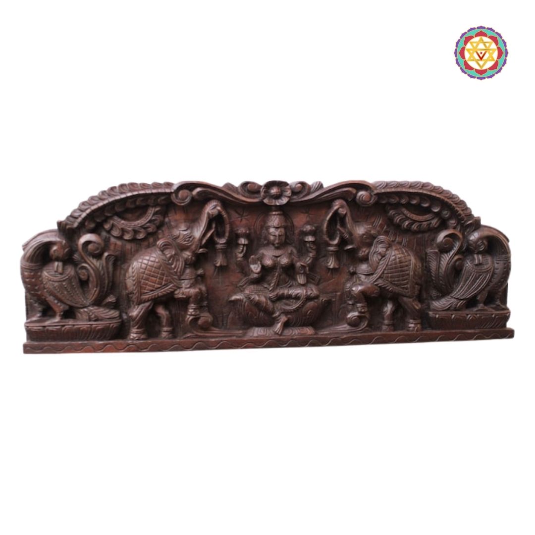 gajalakshmi panel angled view highlighting deep wood carving and motifs