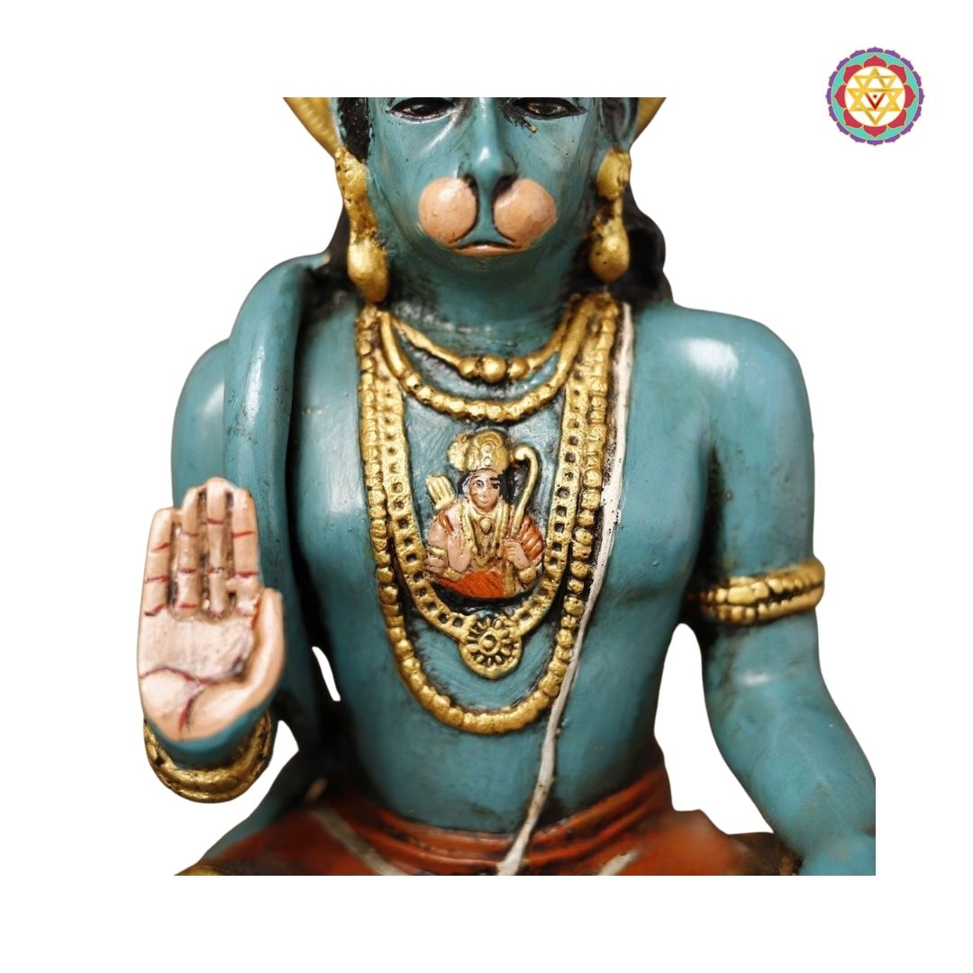 detailed view of Hanuman hands and carved accessories in traditional style