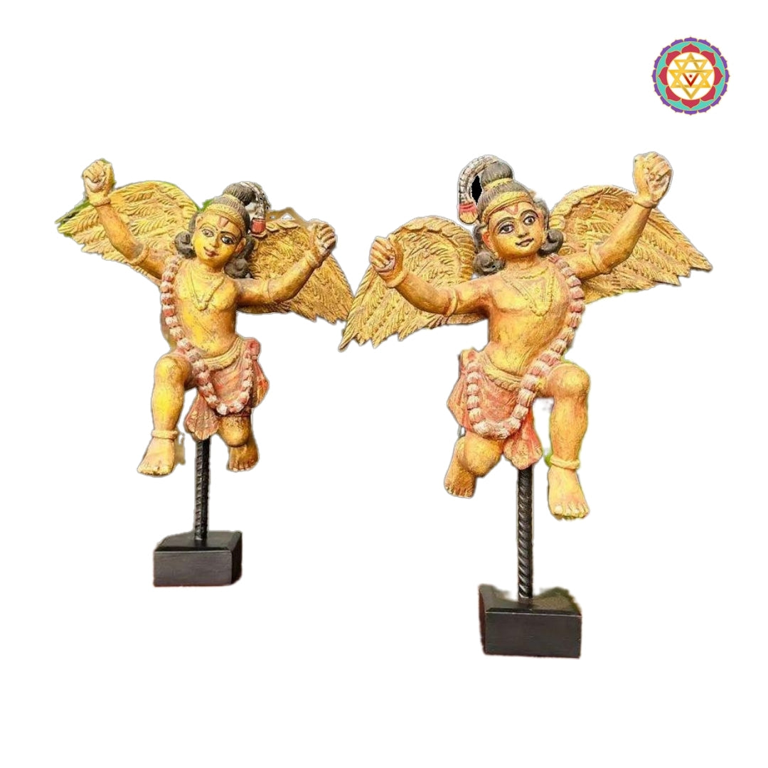 wooden sculpture showing indian celestial angel with garland