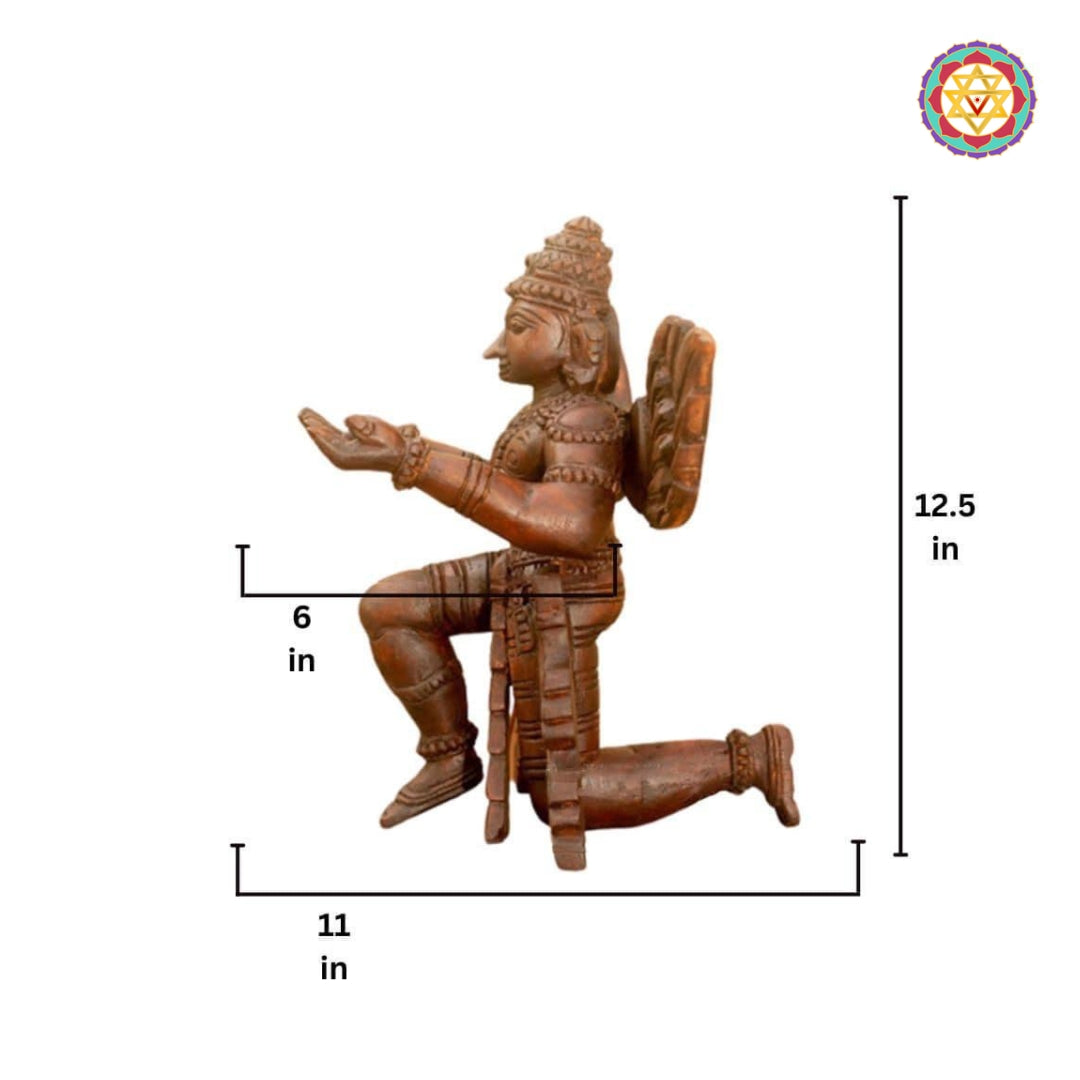 Close-up of Garuda wooden sculpture pedestal and carving details — fine craftsmanship, traditional Indian temple art