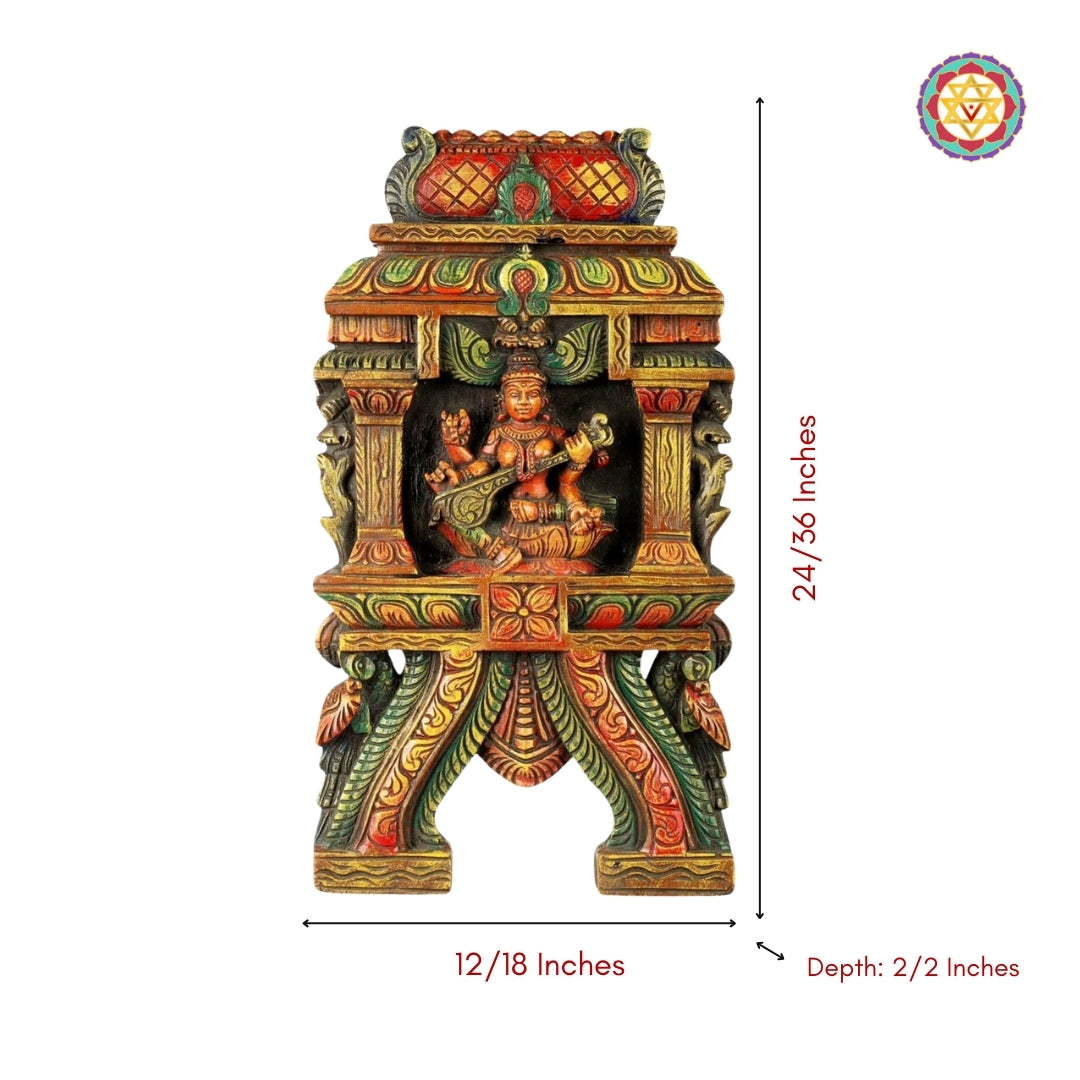 wooden wall hanging of goddess saraswathi with veena and peacocks