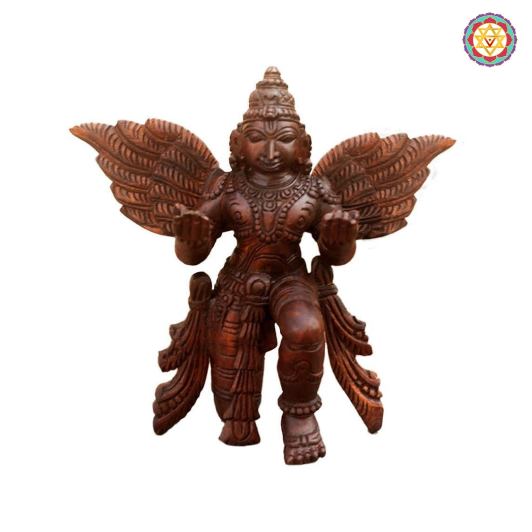 Front view of Garuda wood carving seated in meditation posture — intricate detailing on wings and crown, antique polish finish