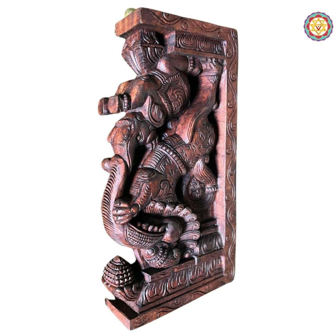 Close-up view of Yali elephant wall bracket showing detailed handcarved textures and floral patterns