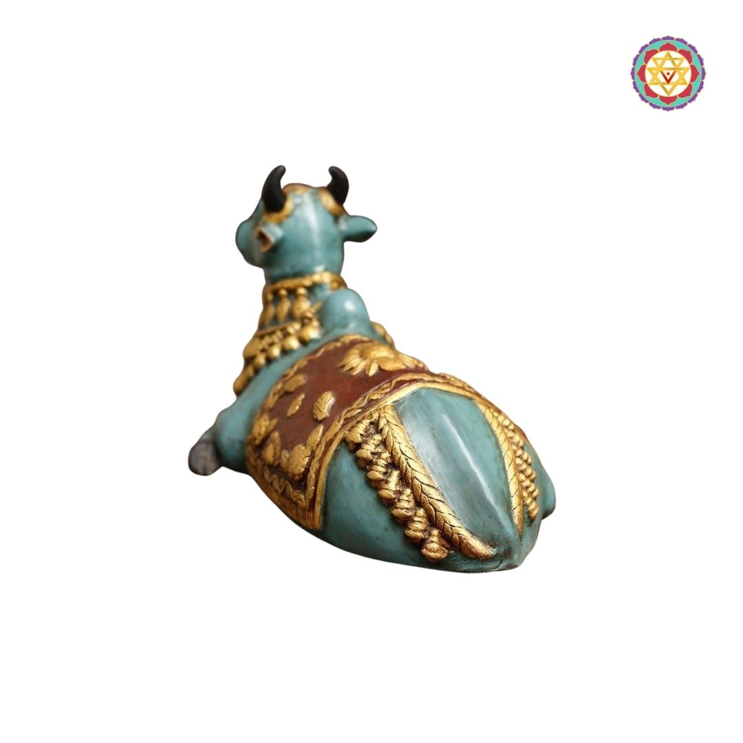 side profile of blue Nandi idol emphasizing sculpted musculature and polish
