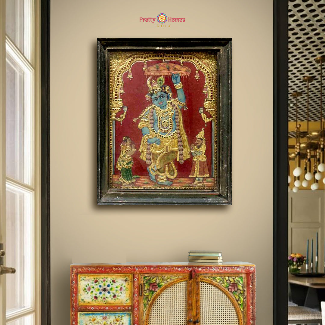 Krishna lifting Govardhan in a classic Lord Krishna Tanjore painting