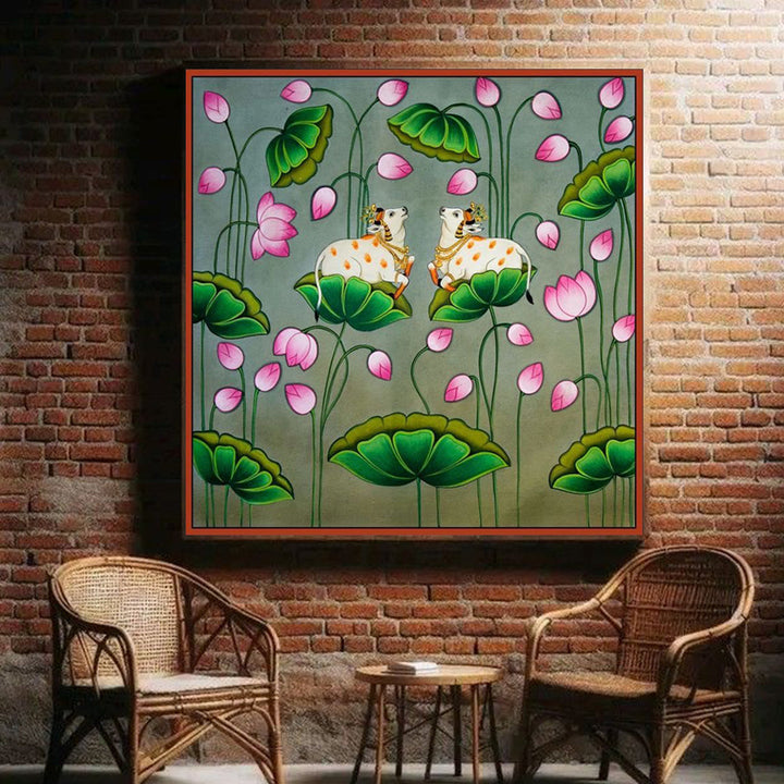 pichwai painting of cows surrounded by lotus flowers and green leaves