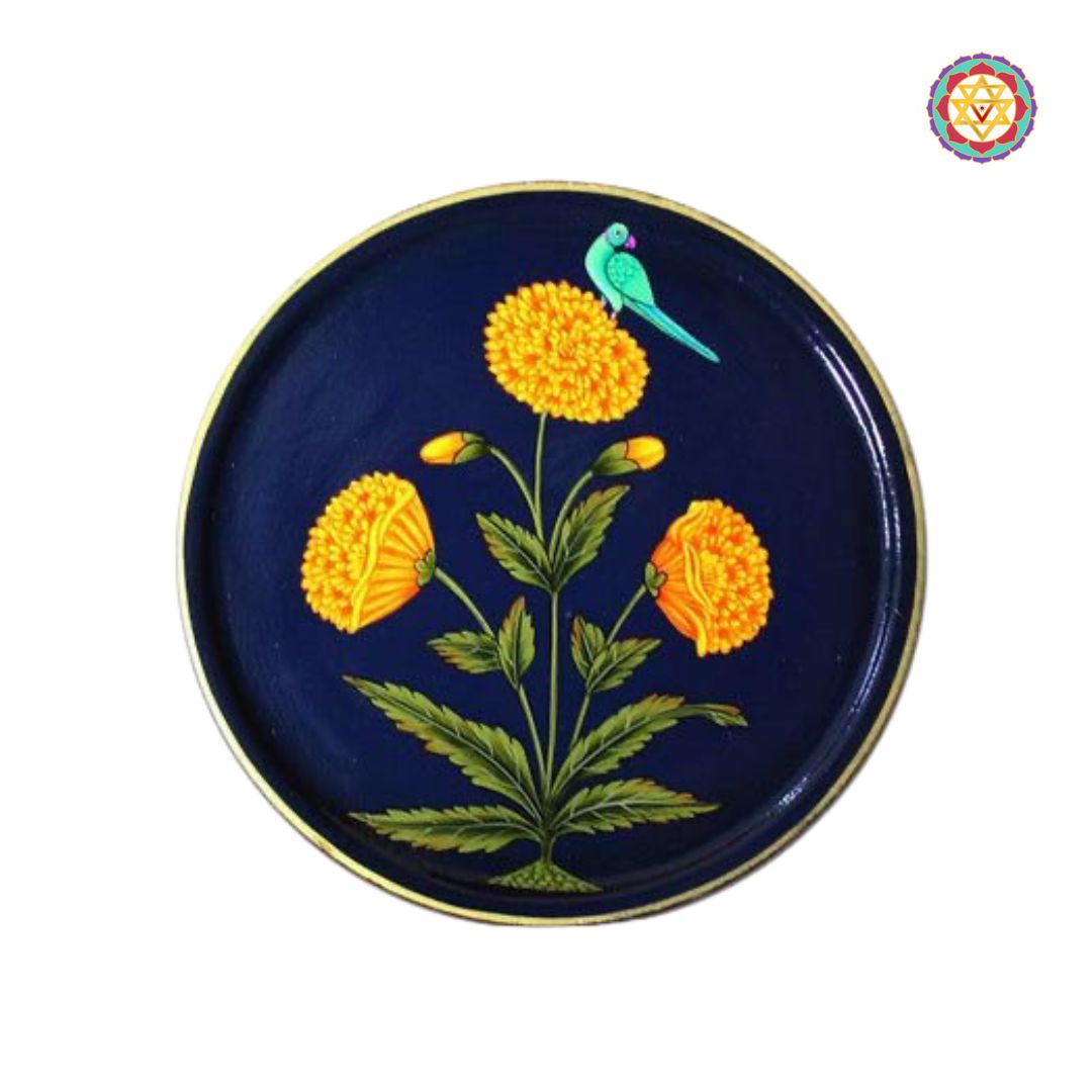 Detailed pichwai art marigold wall plate on dark background.
