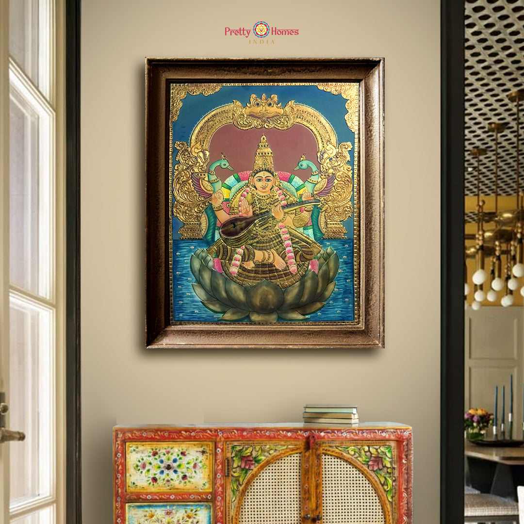 Framed Saraswati Tanjore painting with real 22-carat gold foil detailing
