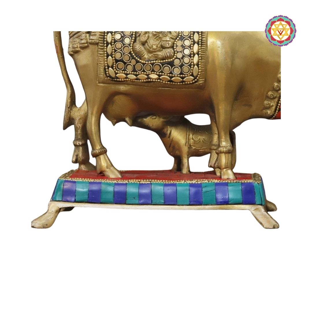 close-up of Kamdhenu cow and calf idol highlighting stone inlay work