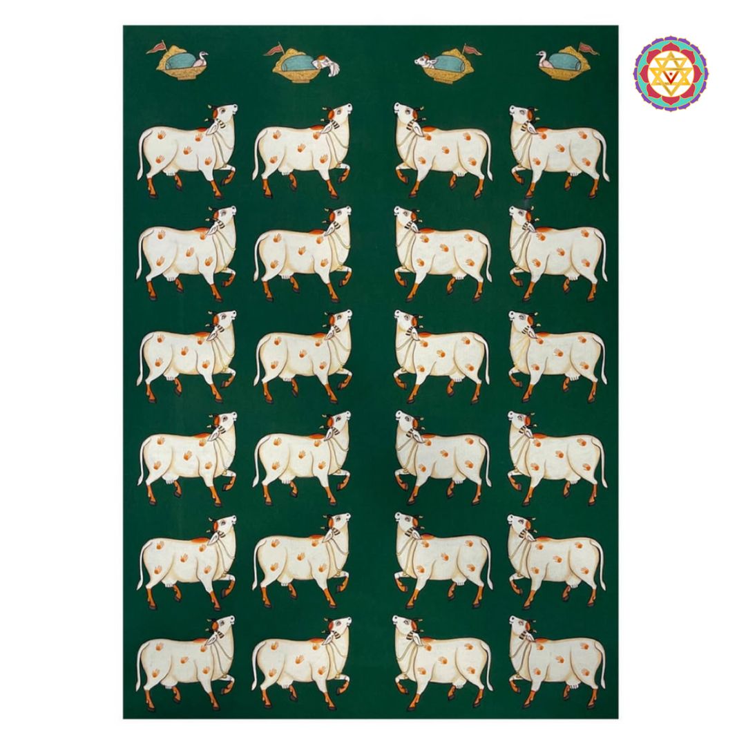 White cows on green background — hand-painted pichwai wall art in modern interior.