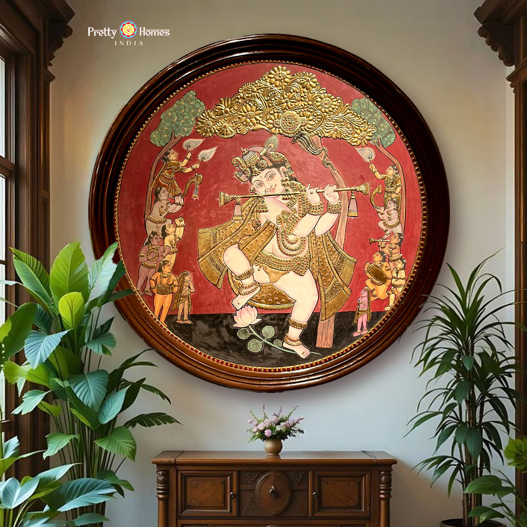 close-up of dancing krishna tanjore showing movement detail and handgilded highlights