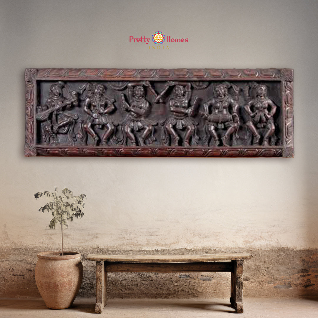 Wood wall paneling showing dancing Apsaras with instruments