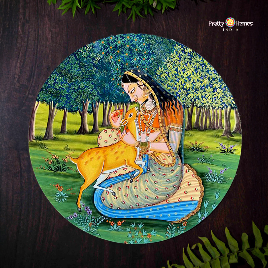 Princess playing with deer handpainted pichwai wall plate in forest setting