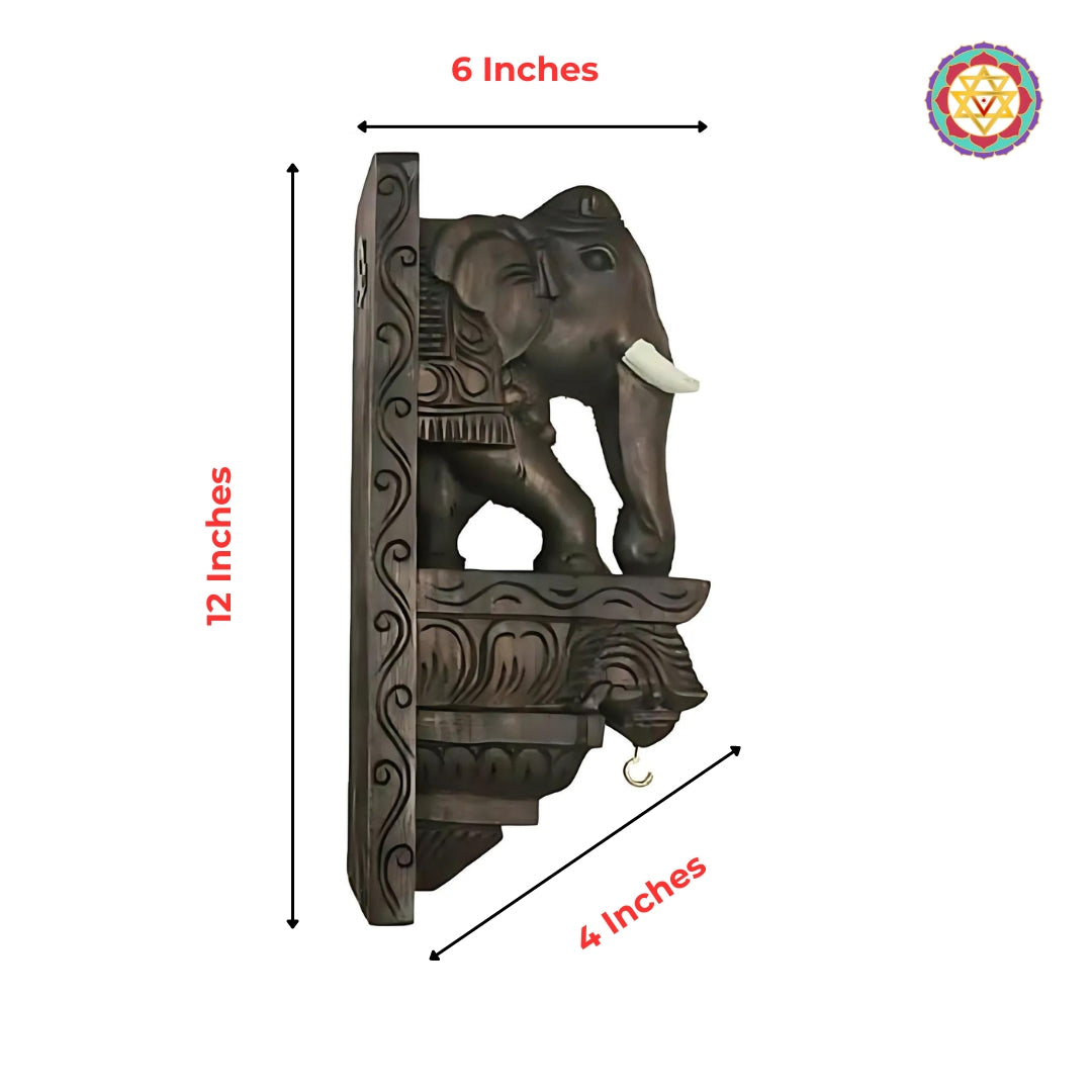 Carved wooden elephant wall corbel with ornamental hook and dark antique finish.