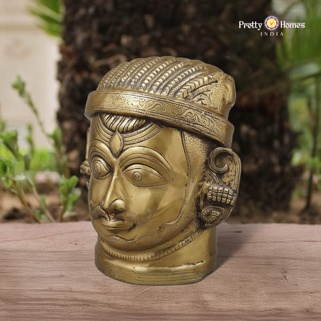 brass Shiva face idol with rich golden finish and detailed crown