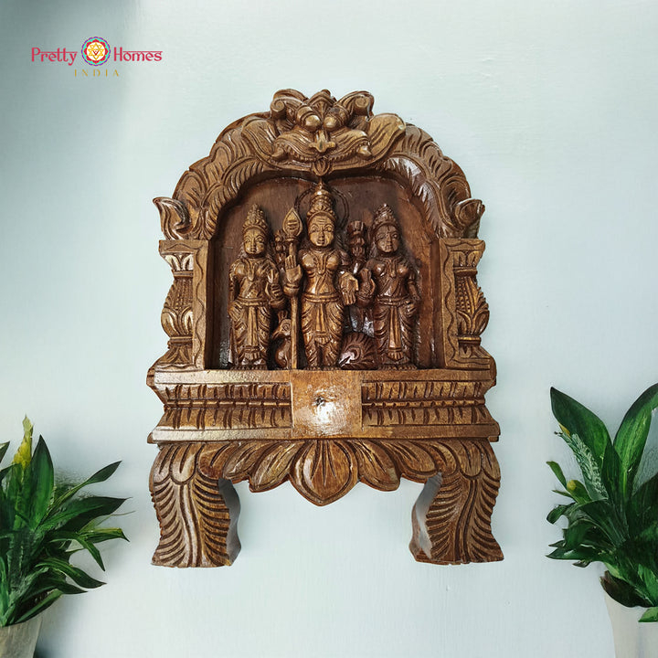 Woodcarved lord Murugan frame with yali and lotus carvings