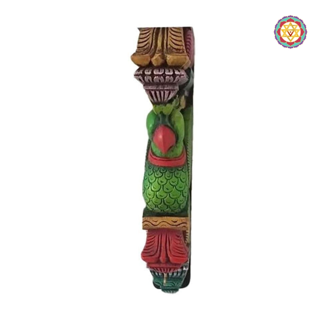 Angled view of parrot bracket showing colorful detailing and intricate scroll carvings