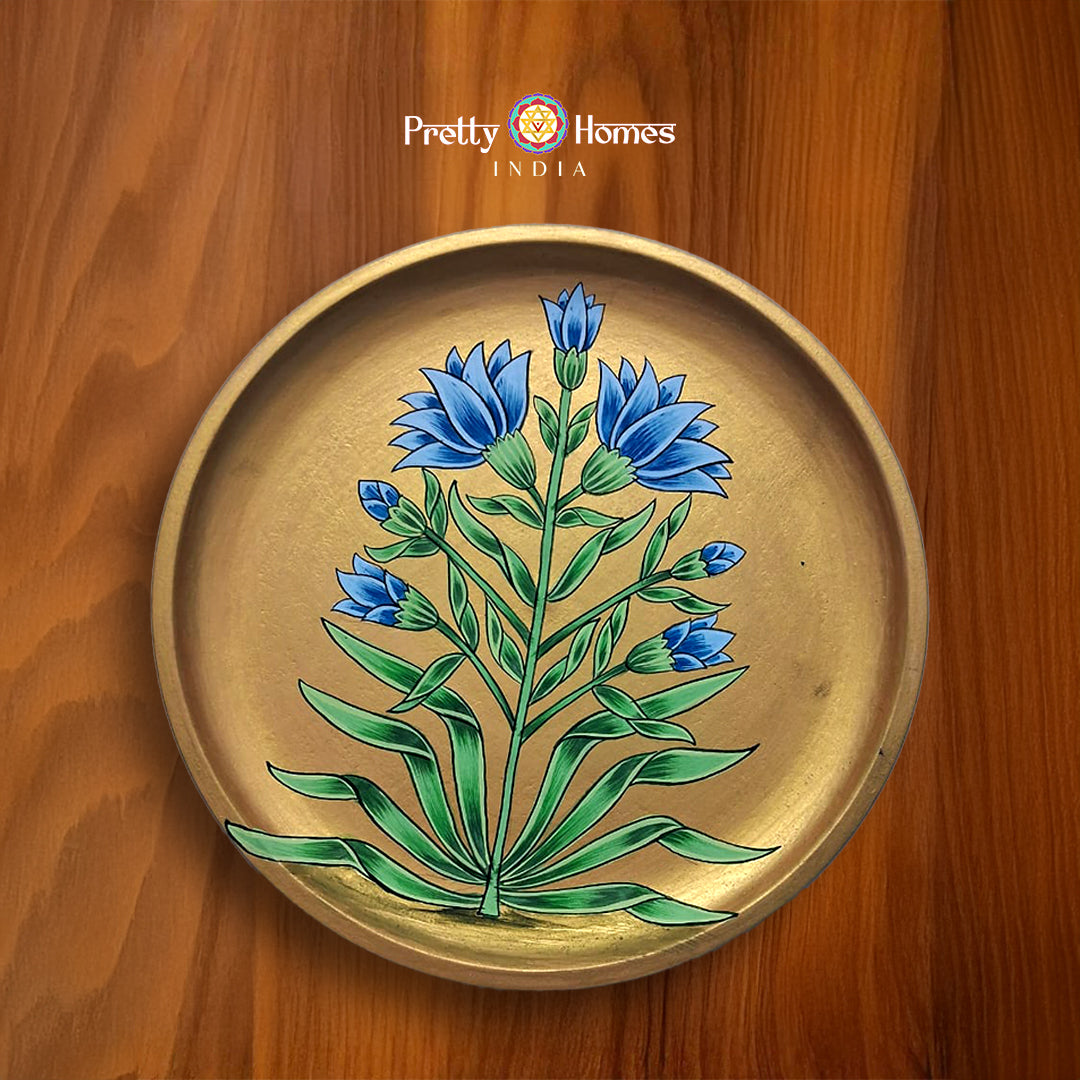Hand-painted wall plate with blue bell florals, pichwai art image.