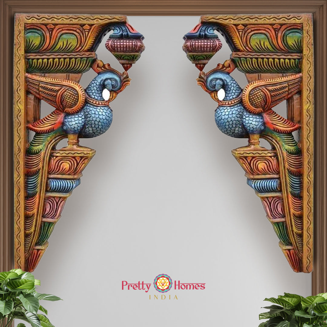Close-up view of wooden parrot bracket showing painted wings and delicate floral craftsmanship